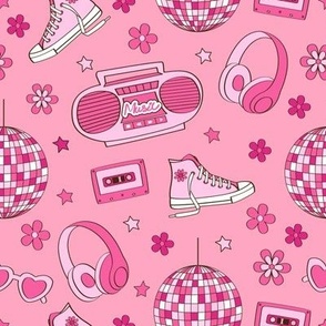 record player, sneakers, headphones on a pink background