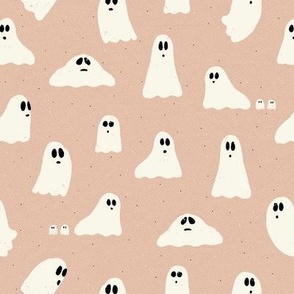 Spooky ghosts on Halloween night on a light pink textured background - friendly ghost parade