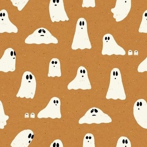 Spooky ghosts on Halloween night on a caramel textured background - friendly ghost parade