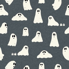 Spooky ghosts on Halloween night on a denim blue textured background - friendly ghost parade