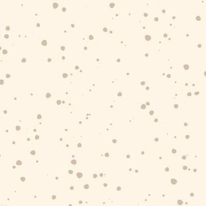Warm Tan Dots Scattered on a Cream Colored Background