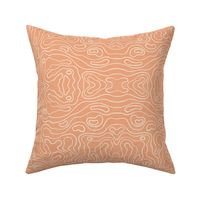 Large wavy watery textured block printed topographic lines in retro colors of coral on sandy cream