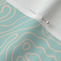 Large wavy watery textured block printed topographic lines in retro colors of light teal on sandy cream