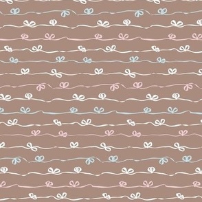 Ribbons with bows tied in a continuous horizontal stripe in brown, baby pink, baby blue and white - small