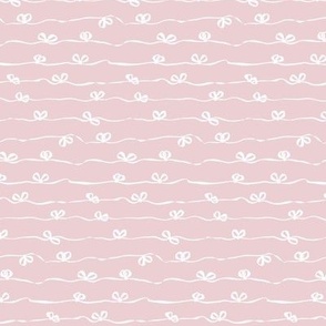 Ribbons with bows tied in a continuous horizontal stripe in light pink and white - small