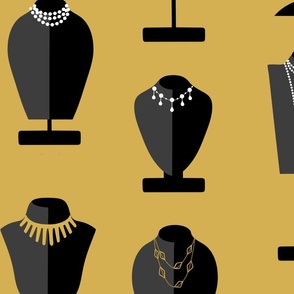 Necklaces on black busts in gold