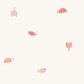small coral pink and red ladybugs on cream ivory white
