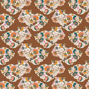 Floral cats on brown