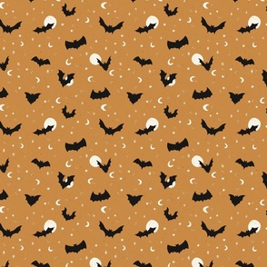 Flying bats on Halloween night with stars and moons in caramel yellow - small size