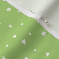Scattered white Stars on pea green - tiny scale