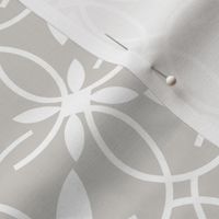 Elegant white pattern on a light gray background. 