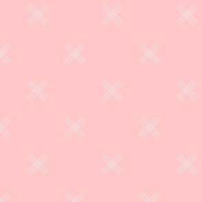 White crosses on baby pink