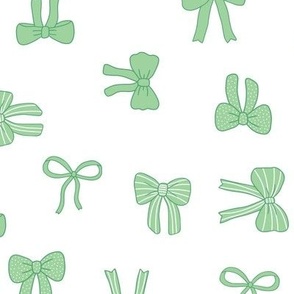 Girly Bows green on white tossed multi-directional