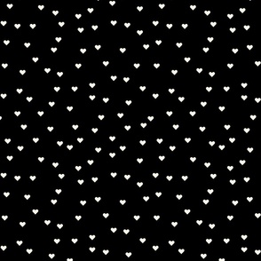 (S) Cream hearts on black background pattern