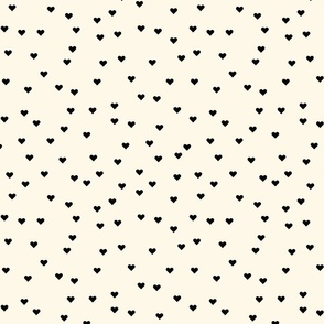 (S) Black hearts on cream background pattern