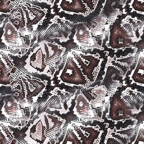 Snake skin. Black, brown, beige pattern stylized as snake skin.