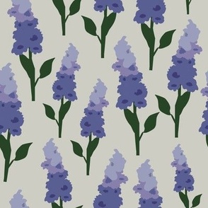 Purple shades of lupin flowers vector artwork repeat pattern on cream background