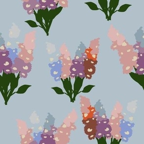 Pastel coloured lupin bouquets on light blue background