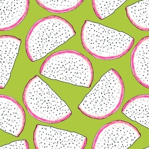 Dragonfruit slices on a green background