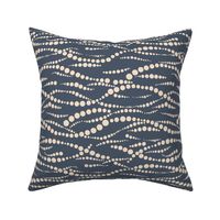 Dotted ocean wave lines horizontal - beige on pastel dark blue background