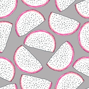 Dragonfruit slices on a gray background