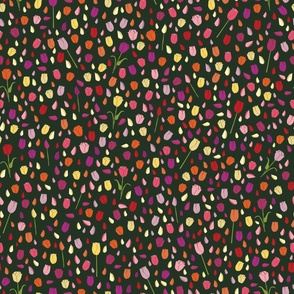 Colourful tulips with scattered petals on dark background vector repeat pattern