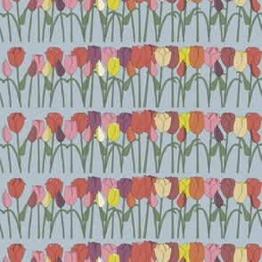 Pretty, colourful, black outline, tulips standing in a row on a blue background