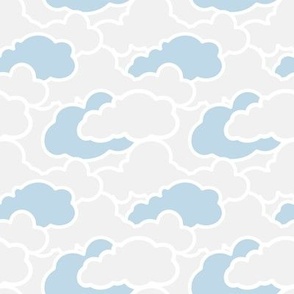 Calm Fluffly playful white clouds blue sky