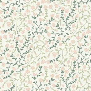 Ditsy floral tossed light pink flowers and green leaves on a light green background Medium