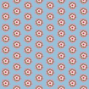 Boho flower medalions pink and green on soft blue