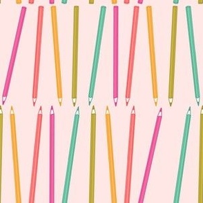 Colored Pencils in a Row on Pink