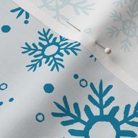 Blue snowflakes on light background