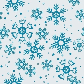 Blue snowflakes on light background