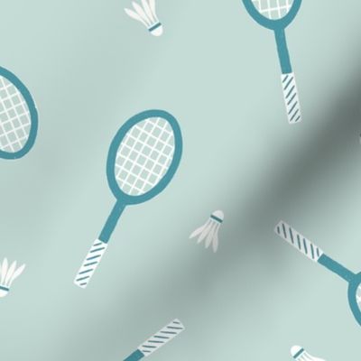 Sport Lovers: Teal Badminton Rackets and Shuttlecocks on a Dusty Blue Background