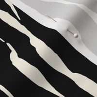 (M) animal print - cream striped tiger-zebra over black background