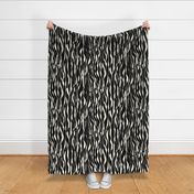 (M) animal print - cream striped tiger-zebra over black background