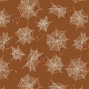 Spiderwebs, spiders and boos, not so scary spiders saying boo on halloween in brown on a medium scale