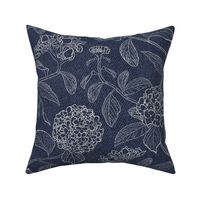 White trailing floral hydrangea on dark denim background