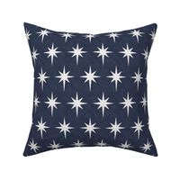 White star of Bethlehem on indigo denim background