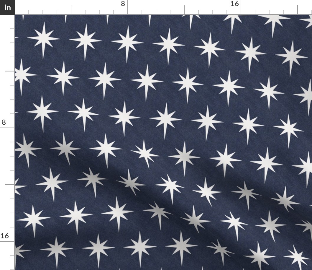 White star of Bethlehem on indigo denim background