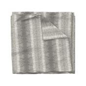 Small horizontal tone and texture organic variegated stripe in dark warm grey on off white ecru