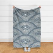 Evil eye on a denim textured background