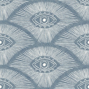 Evil eye on a denim textured background