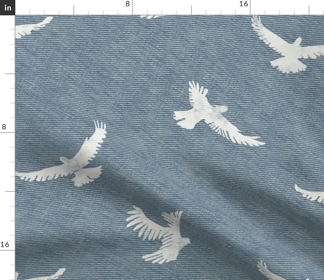 White coastal flying birds on denim background