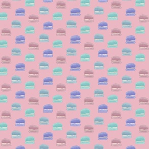 Hand painted macaroons in pink, blue, teal, and purple on a pink background  - medium