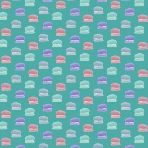 Hand painted macaroons in pink, blue, teal, and purple on a teal background - medium