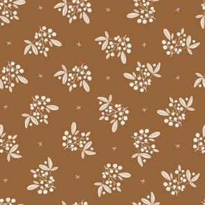 Berries and leaves in polka dots style - white on copper brown background