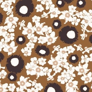 Garden flowers daffodils in white and eggplant violet on copper brown background