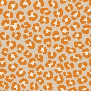 Playful leopard print, orange spots on light beige