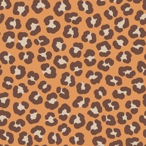 Playful leopard print, brown spots on orange